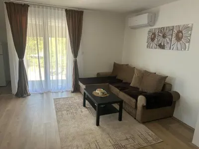 a living room with a couch and a table at Daily corner in Bujanovac