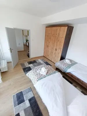 two beds sitting on the floor of a room at Apartman Viševac Vranje in Vranje