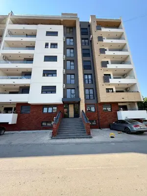 an apartment building with stairs in front of it at Royal Apartmani 3 in Paraćin