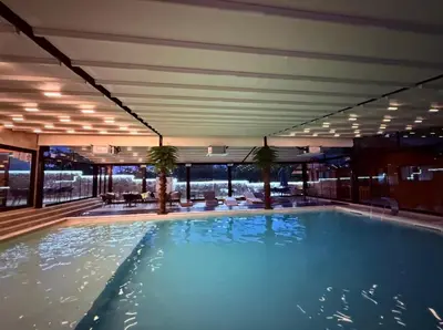 a large swimming pool in a hotel room at CHlLL HILL in Vrnjačka Banja