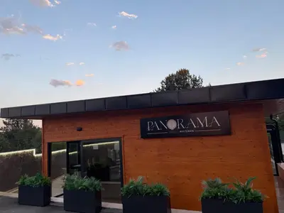 a building with a sign that reads ryanarma at CHlLL HILL in Vrnjačka Banja
