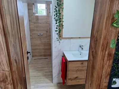 a bathroom with a sink and a shower at Apartmani Park Cuprija in Ćuprija