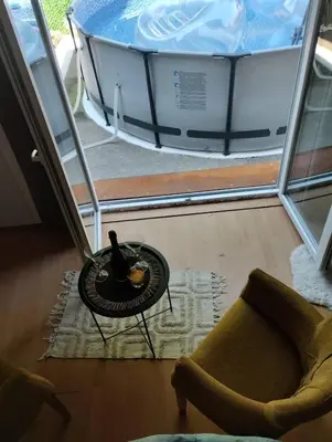a room with a table and a bath tub at Apartman Sweet Dreams in Svrljig