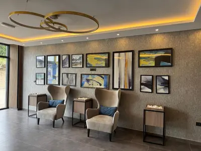 a waiting room with chairs and pictures on the wall at A10 Residence hill, Kopaonik in Kopaonik