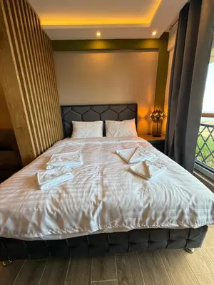 a bedroom with a bed with two books on it at A10 Residence hill, Kopaonik in Kopaonik