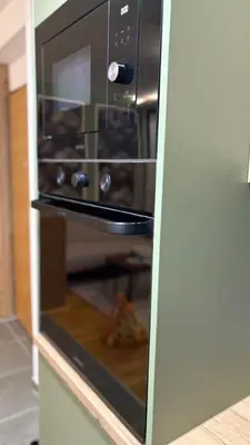a microwave oven with its door open in a kitchen at Studio Crnjanski in Jagodina