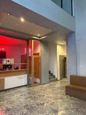 a lobby with a couch in a building at Studio Crnjanski in Jagodina