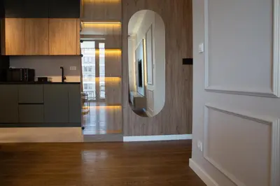 a kitchen with a sink and a mirror in a room at Planet Imperial Apartman & SPA in Niš