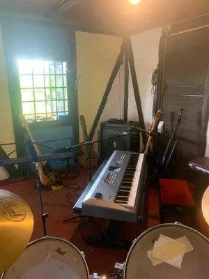 a room with a keyboard and drums in it at Kuća Sokolovića in Zaječar