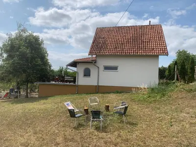 a group of chairs in front of a house at Kuća Sokolovića in Zaječar