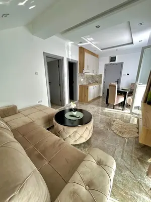 a living room with a couch and a table at L apartmani in Soko Banja