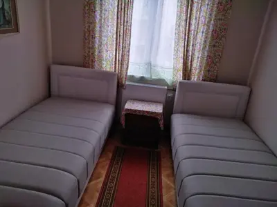 a small room with two couches and a window at Apartmani Lucky in Vrnjačka Banja