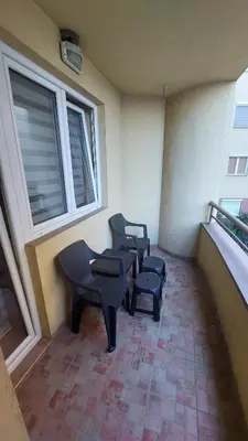 a balcony with two benches and a window at Apartman Dona in Jagodina