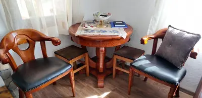 a small table with two chairs and a table with a bowl on it at Vila Stara in Pakleštica