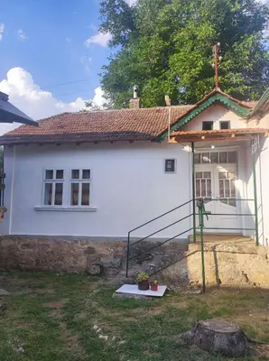 a white house with a staircase in front of it at Konak Anja