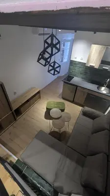 an overhead view of a kitchen with a table and stool at Central House Niš in Niš