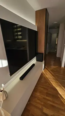 a large flat screen tv on a wall in a living room at Sila apartman Vrnjačka Banja in Vrnjačka Banja