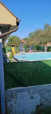 a view of a swimming pool with a playground at Zuto brdo Batinac
