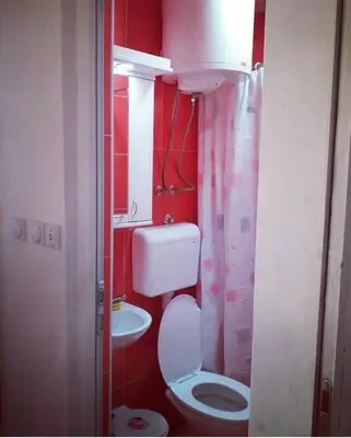 a small bathroom with a toilet and a sink at Apartman Smilic Lukovska banja in Lukovo