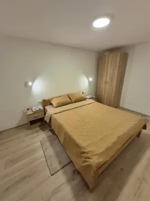 a bedroom with a large bed in a room at Oaza apartman in Soko Banja
