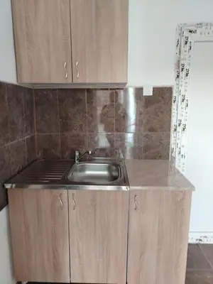 a kitchen with a sink and a counter top at Смештај Вероника и Симона