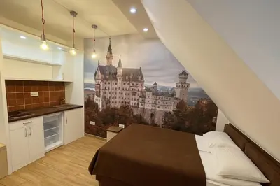 a bedroom with a large castle mural on the wall at Central Konaci Apartments & Studio by Husky in Kopaonik