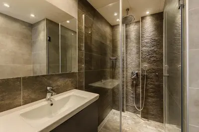 a bathroom with a sink and a shower at Central Konaci Apartments & Studio by Husky in Kopaonik