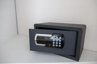 a black tv with a safe on a wall at Apartman Sunce Lux N in Vrnjačka Banja