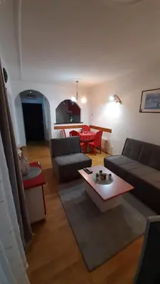 a living room with a couch and a table at Apartman Jezero in Vrnjačka Banja