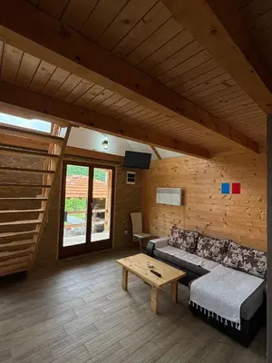 a living room with a couch and a table at Vikendice Jovicic in Bukorovac
