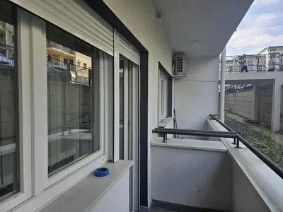 a balcony of a house with a window at Apartman Marija II in Vrnjačka Banja