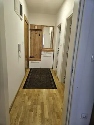 a hallway of a kitchen with a sink and a counter at Apartman Marija II in Vrnjačka Banja