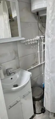 a bathroom with a sink and a toilet at Studio Trajkovic in Vranje