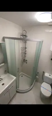 a bathroom with a shower and a toilet at Nord Ski - SPA apartman Kraljevi Čardaci in Kopaonik