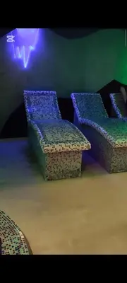 a room with two chairs and a table with lights at Nord Ski - SPA apartman Kraljevi Čardaci in Kopaonik