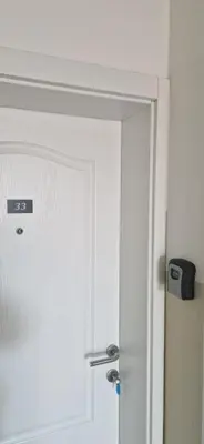 a door to a bathroom with a white door at PlavDom2 in Ćuprija
