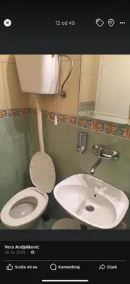 a bathroom with a toilet and a sink at Neda in Niš