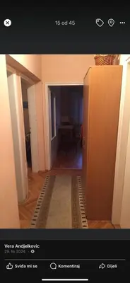 a room with a hallway with a door and a carpet at Neda in Niš