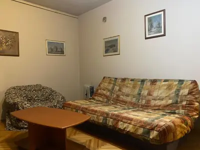 a living room with a couch and a table at Neda in Niš