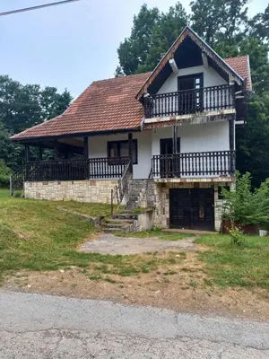 an old house with a roof and a porch at Paradise in Lipova in Vrnjačka Banja