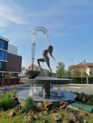 a statue of a person jumping in a fountain at Paradise in Lipova in Vrnjačka Banja