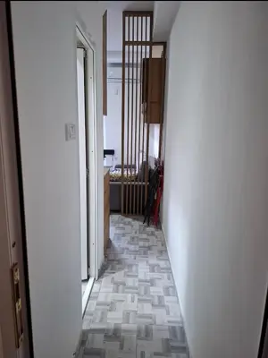 a hallway with a tile floor in a room at Clementine in Soko Banja