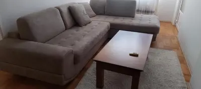 a living room with a couch and a coffee table at Stamenković in Vranje