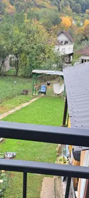 a view from a balcony of a yard with a gazebo at Apartman Viktorija in Jošanička Banja