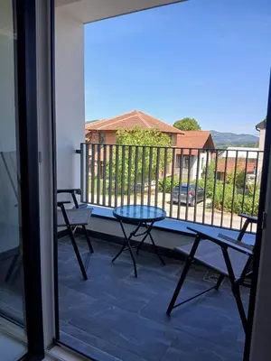 a view of a balcony with a table and chairs at Aprtman SALE in Vrnjačka Banja