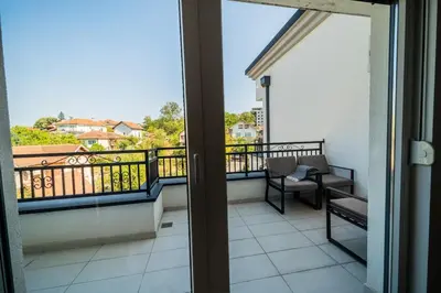 a balcony with a view of a balcony with a chair at Park Studio 19 in Vrnjačka Banja
