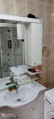 a bathroom with a sink and a mirror at DDS-Niš in Niš