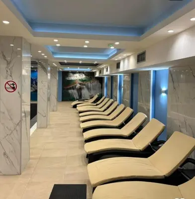 a row of chairs lined up in a hallway at Apartman President Kop in Kopaonik