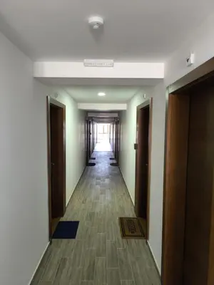 a hallway of a hotel with a hallway of doors at Apartman President Kop in Kopaonik