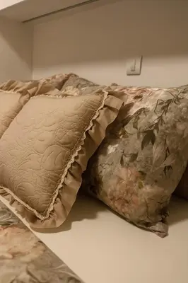 a bed with two pillows on top of it at Luxury Stay in Vrnjačka Banja D3 in Vrnjačka Banja